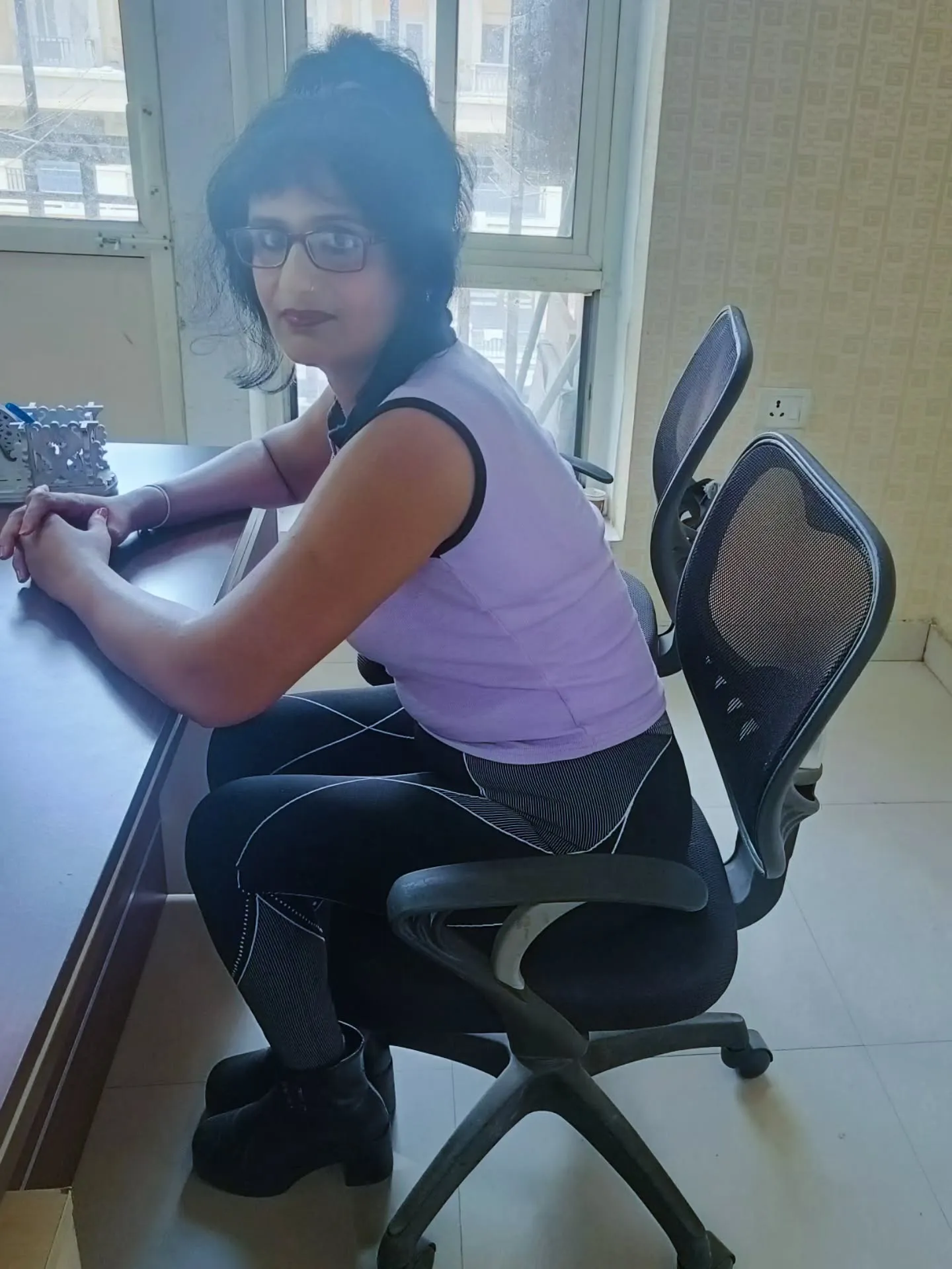 Richa Gupta at her desk — studying and working